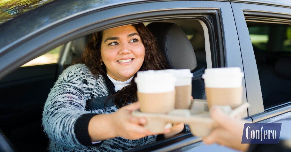 Customer ordering at drive thru counter with cashier — beverage upselling case study, Confero customer experience research