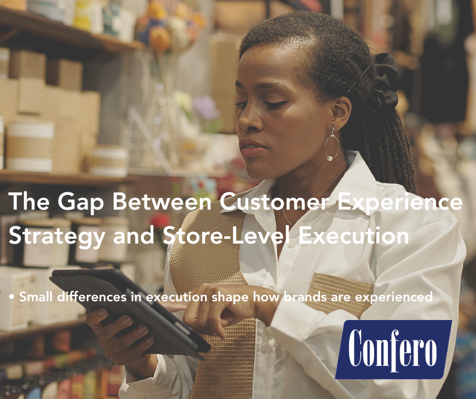 A retail store manager reviewing tasks on tablet showing how customer experience strategy is executed in-store.