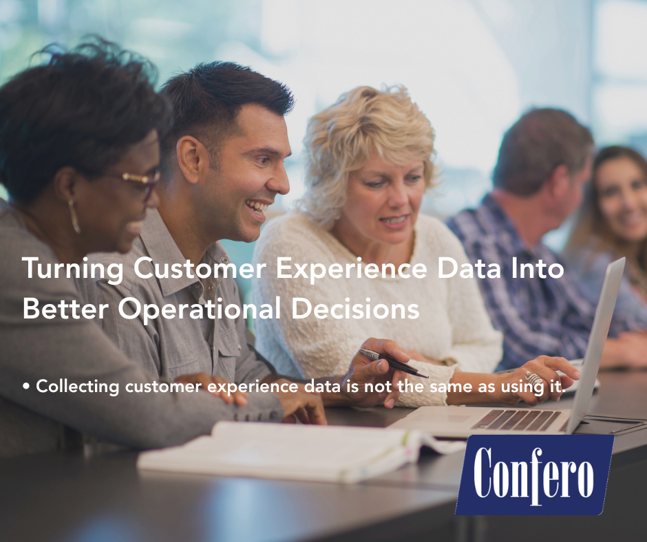 team members reading data on a screen together in a restaurant. This illustrates Turning Customer Experience Data Into Better Operational Decisions that empowers by giving the right info to the right leaders as a precursor to improving operations and customer experience.